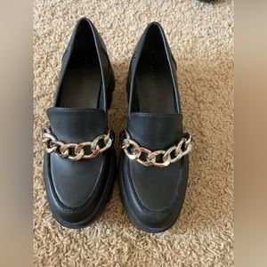 black loafers with gold chain